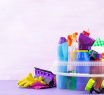 Cleaning service concept. Colorful cleaning set for different surfaces in kitchen, bathroom and other rooms.